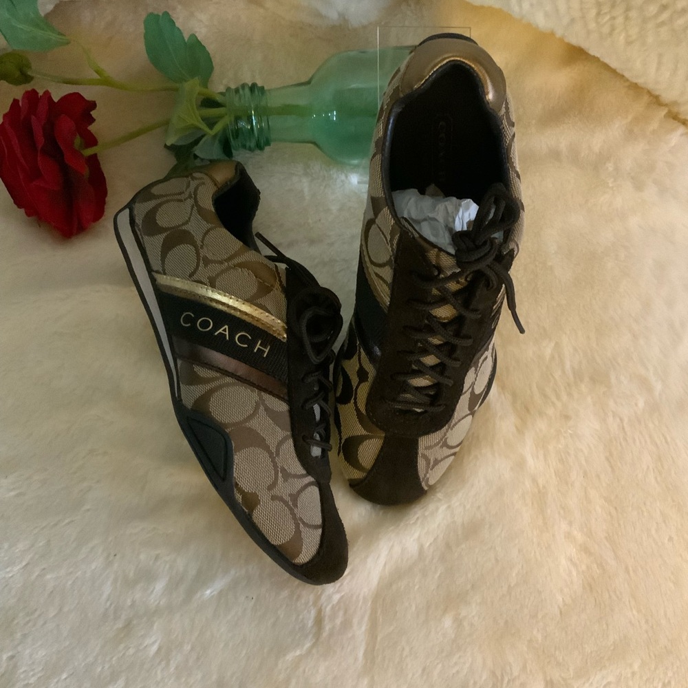 Coach Women's Brown and Tan lace up Sneakers.
